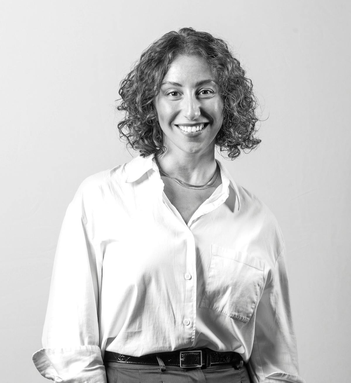 a person smiling at the camera.