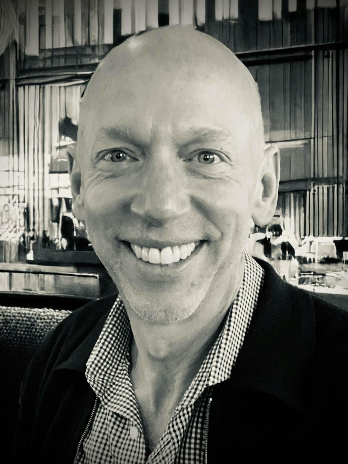 a man smiling at the camera
